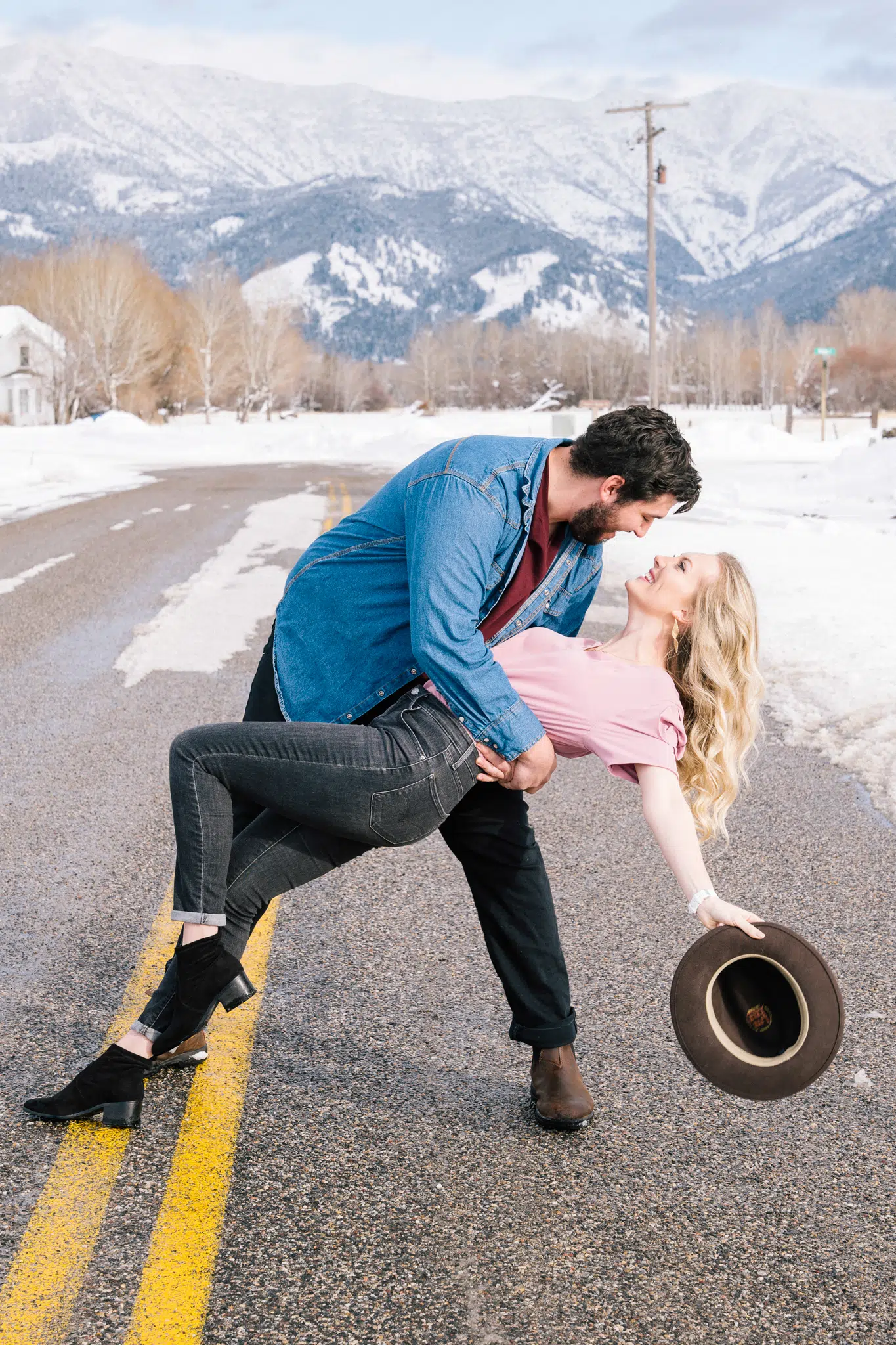 Best Places To Take Engagement Photos | Couple Dancing In Front Of Bridger Mountains