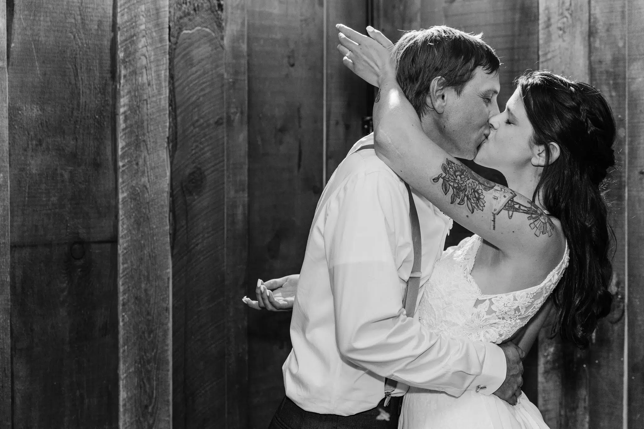 How Much Does A Wedding Photographer Cost // Couple Kissing At Wedding Reception