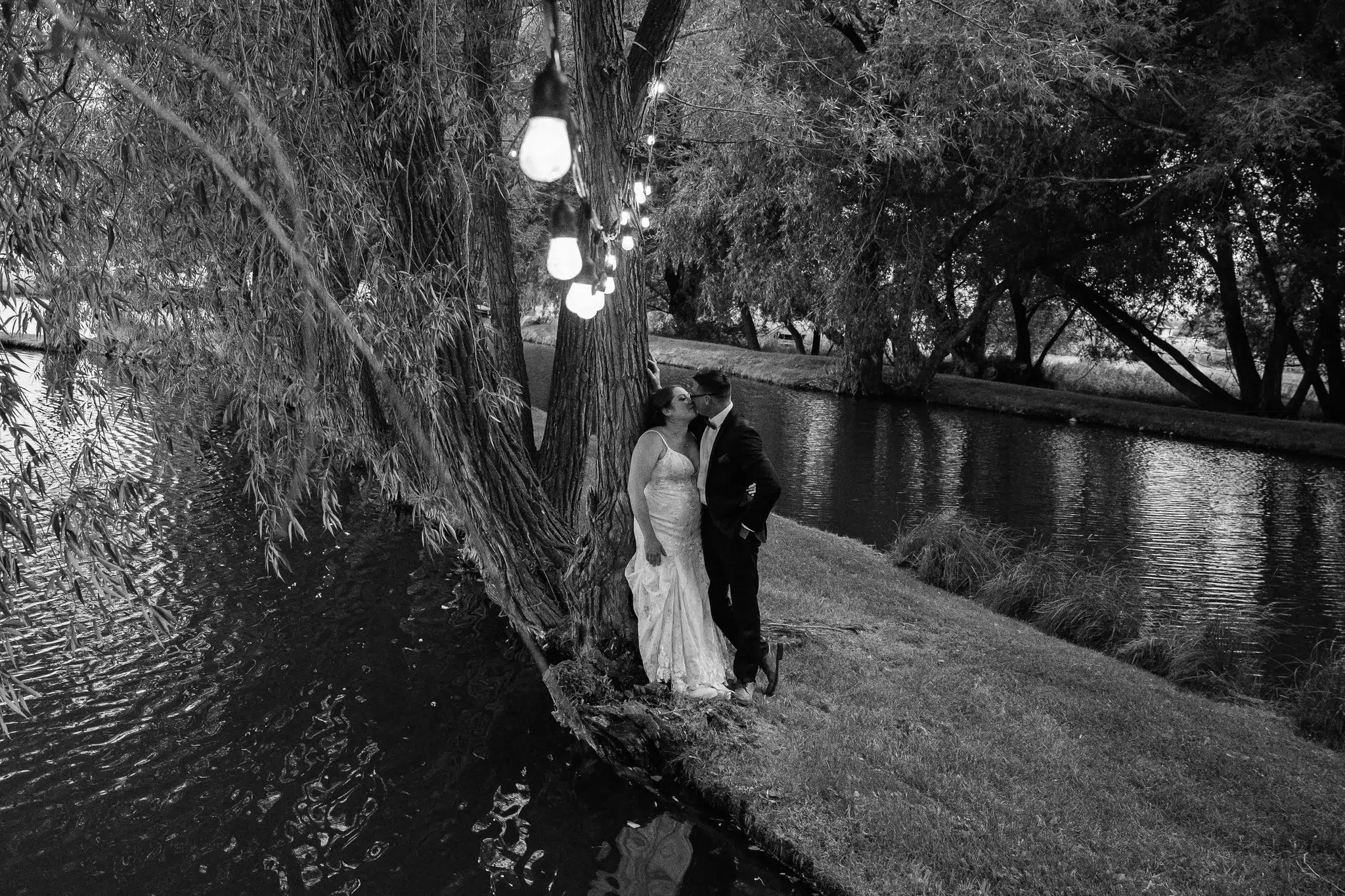 23.Bozeman Wedding Photographer Charles Moll Photography Portfolio Couple Kissing By Ponds