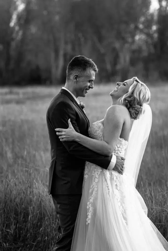 Should You Tip Your Wedding Photographer? Photo Of A Couple Laughing 