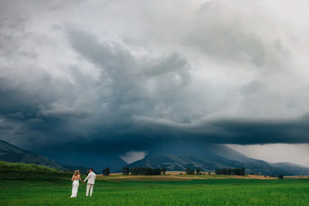 Bozeman Wedding Planning Guide Couple In Front Of Mountain With Storm